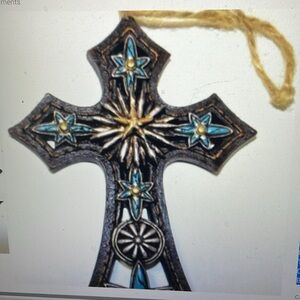 Cross ornament with blue six point stars
